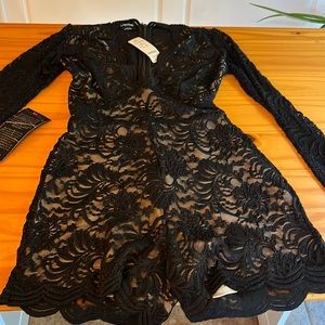 Bebe lace one piece romper new size is 0 in black